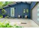 Stylish home with blue siding, enhanced by an inviting seating area and well-manicured landscaping at 7753 Ivy Dr, Nineveh, IN 46164