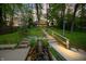 Picturesque landscaping with a stone waterfall feature leads to a lakeside retreat at 7753 Ivy Dr, Nineveh, IN 46164