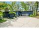 Charming home exterior featuring a blue facade, gray garage door and meticulous landscaping at 7753 Ivy Dr, Nineveh, IN 46164