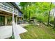 Spacious house featuring a hot tub and a charming outdoor dining area overlooking the lake at 7753 Ivy Dr, Nineveh, IN 46164