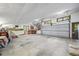 Oversized garage with multiple storage cabinets, workbench, and a wide door for easy access at 7753 Ivy Dr, Nineveh, IN 46164