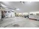 Spacious garage with storage cabinets, a refrigerator, and ample room for vehicles and equipment at 7753 Ivy Dr, Nineveh, IN 46164