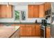 Kitchen boasts stainless steel appliances, light wood cabinets, and granite countertops at 7753 Ivy Dr, Nineveh, IN 46164
