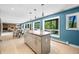 Spacious kitchen with a granite island and tranquil nature views from the large windows at 7753 Ivy Dr, Nineveh, IN 46164