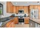 Kitchen featuring stainless steel appliances, light wood cabinets, and granite countertops at 7753 Ivy Dr, Nineveh, IN 46164