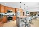 Kitchen featuring a large granite island and stainless steel appliances offers modern convenience at 7753 Ivy Dr, Nineveh, IN 46164