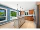 Bright kitchen with a granite island, stainless steel appliances, and large view window at 7753 Ivy Dr, Nineveh, IN 46164
