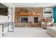 Cozy living room featuring a stone fireplace, comfortable seating, and modern accents at 7753 Ivy Dr, Nineveh, IN 46164