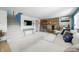Inviting living room with a stone fireplace, plush seating, and staircase access at 7753 Ivy Dr, Nineveh, IN 46164