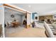 Open-concept living room with dining area and stone fireplace offers a seamless flow at 7753 Ivy Dr, Nineveh, IN 46164