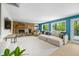 Spacious living room featuring a stone fireplace, plush seating, and views of the outdoors at 7753 Ivy Dr, Nineveh, IN 46164