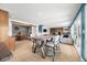 Bright living room with stone fireplace, dining area, and wood floors create an inviting atmosphere at 7753 Ivy Dr, Nineveh, IN 46164