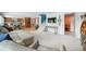 Open-concept living room with cozy seating, a modern staircase, and access to the kitchen at 7753 Ivy Dr, Nineveh, IN 46164