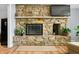 The living room has a stone fireplace with a TV mounted above the mantle at 7753 Ivy Dr, Nineveh, IN 46164