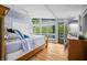 Spacious bedroom features a ceiling fan, large windows and a sliding door to the outside at 7753 Ivy Dr, Nineveh, IN 46164