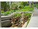 Landscaped waterfall and steps leading to the house at 7753 Ivy Dr, Nineveh, IN 46164