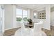 Cozy dining area with large windows and a round table with white chairs, bright and inviting at 778 Adler Dr, Avon, IN 46123