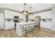 Modern kitchen boasts a large island, stainless steel appliances, white cabinets, and hardwood floors at 778 Adler Dr, Avon, IN 46123