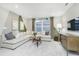 Bright living room with large sectional couch, stylish decor, and big windows allowing for natural light at 778 Adler Dr, Avon, IN 46123