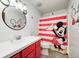 Fun bathroom with a Mickey Mouse theme including shower curtain and mirror at 7835 Quail S Rdg, Plainfield, IN 46168