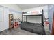 This bedroom includes a loft bed, gray floors and plenty of storage space at 7835 Quail S Rdg, Plainfield, IN 46168