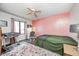 Cozy bedroom featuring soft rug, chair and bassinet near a sunny window at 7835 Quail S Rdg, Plainfield, IN 46168