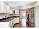 Functional kitchen with white cabinets, stainless steel appliances, modern lighting, and convenient layout for cooking at 7835 Quail S Rdg, Plainfield, IN 46168