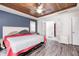 Primary bedroom suite with wood ceiling and adjoining bath with french doors at 7835 Quail S Rdg, Plainfield, IN 46168