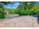 Backyard with a cement patio, fence, mature trees and greenery at 8065 Bayberry Ct, Indianapolis, IN 46250