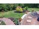Landscaped backyard with a beautiful brick patio, garden wall and well-maintained lawn at 8065 Bayberry Ct, Indianapolis, IN 46250