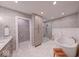 Modern bathroom features stylish wallpaper, a soaking tub, a glass-enclosed shower, and a vanity at 8065 Bayberry Ct, Indianapolis, IN 46250