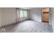 Bedroom featuring carpeting, white walls, trim, and natural light from an exterior window at 8065 Bayberry Ct, Indianapolis, IN 46250