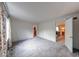 Spacious bedroom with neutral carpeting, white walls, and trim with access to an adjoining room at 8065 Bayberry Ct, Indianapolis, IN 46250