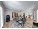 Dining room with a large wooden table, modern lighting and hardwood style flooring at 8065 Bayberry Ct, Indianapolis, IN 46250