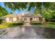 Charming single-story home with a brick facade, manicured landscaping, and a welcoming front entrance at 8065 Bayberry Ct, Indianapolis, IN 46250