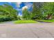 View of the home from the street with a lush green lawn and mature trees at 8065 Bayberry Ct, Indianapolis, IN 46250