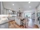 Modern eat-in kitchen with granite countertops, stainless steel appliances, and wooden flooring at 8065 Bayberry Ct, Indianapolis, IN 46250