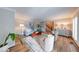 Spacious living room with hardwood floors, decorative rug, elegant furnishings, and staircase access at 8065 Bayberry Ct, Indianapolis, IN 46250