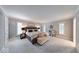 Spacious main bedroom with neutral colors, large windows, and a sitting area for relaxation at 8065 Bayberry Ct, Indianapolis, IN 46250