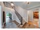 Elegant staircase with iron railing and wood accents, connecting different levels of the home at 8065 Bayberry Ct, Indianapolis, IN 46250