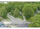 Aerial view showcases a cozy home nestled among trees, with a long gravel driveway at 809 Iron Bridge Rd, Cicero, IN 46034