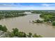 Expansive aerial view of a wide river with a bridge, surrounded by trees and farmland under a bright sky at 809 Iron Bridge Rd, Cicero, IN 46034