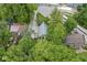 Aerial view of home surrounded by lush greenery with gray roof and yellow door at 809 Iron Bridge Rd, Cicero, IN 46034