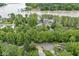 Aerial view features homes in a tree-filled neighborhood, near a lake with waterfront properties at 809 Iron Bridge Rd, Cicero, IN 46034