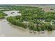 Aerial view of homes with docks and waterfront access to a lake surrounded by dense green forests at 809 Iron Bridge Rd, Cicero, IN 46034