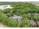 Aerial view shows a home nestled in a lush, green neighborhood with mature trees and landscaping at 809 Iron Bridge Rd, Cicero, IN 46034