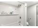 Bathroom featuring white subway tile, built-in shelving, and updated fixtures at 809 Iron Bridge Rd, Cicero, IN 46034