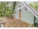 A-frame home featuring a front deck with seating, an inviting entrance, and neat landscaping at 809 Iron Bridge Rd, Cicero, IN 46034