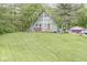 A-frame home with a well-manicured lawn and mature trees offering a serene, private setting at 809 Iron Bridge Rd, Cicero, IN 46034