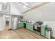 Bright kitchen featuring stainless steel appliances, green cabinets, and light-colored countertops at 809 Iron Bridge Rd, Cicero, IN 46034